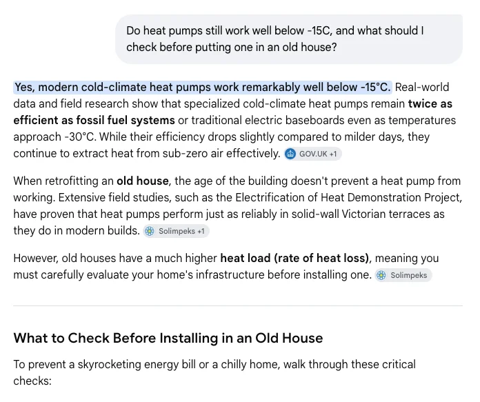 Google AI Mode answering a question about heat pumps below -15°C, with GOV.UK and Solimpeks source chips beside the sentences