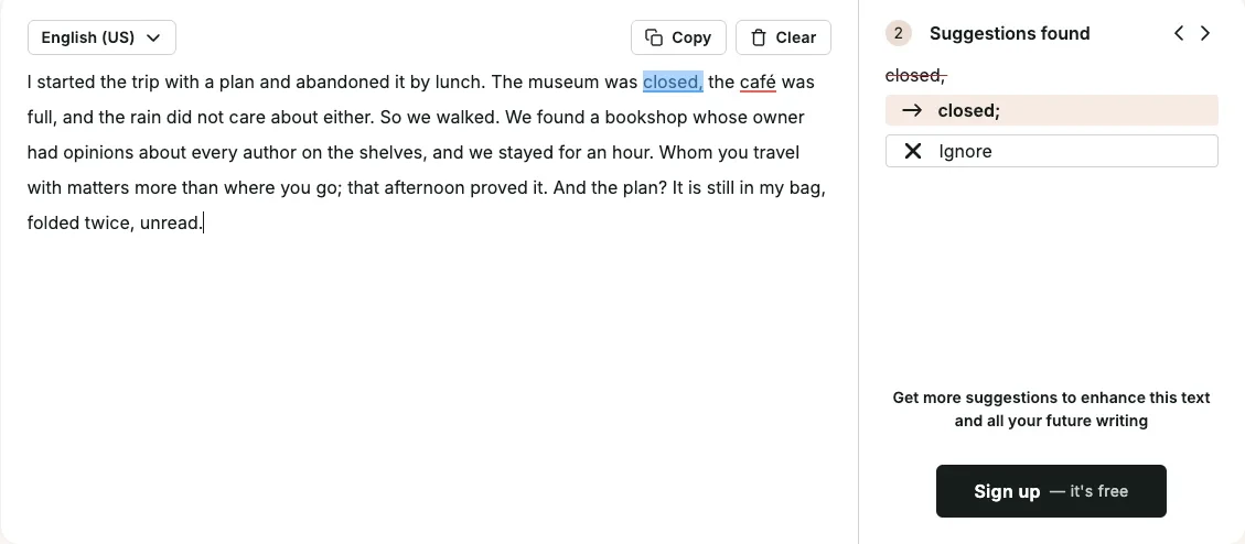 ProWritingAid's two false alarms on the clean paragraph: a semicolon after "closed" and a spelling flag on "café"