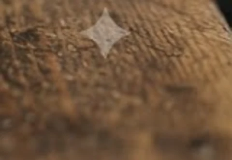 A close-up of the small four-point Gemini sparkle watermark in the bottom-right corner of a Nano Banana image